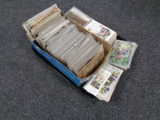 A tray of antique and later postcards