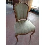 A beech framed French dressing table chair upholstered in a striped fabric