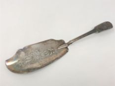 A Georgian silver fish slice, indistinct Newcastle marks, length 29cm.