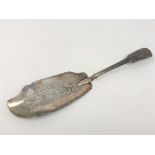 A Georgian silver fish slice, indistinct Newcastle marks, length 29cm.