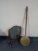 An Edwardian mahogany shield dressing table mirror and a bed warming pan