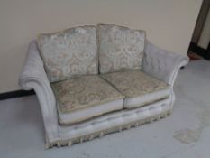 A floral dralon two seater settee