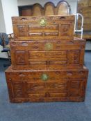 A set of three graduated camphor wood chests with feet