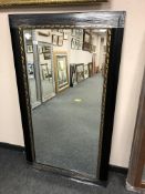 A black framed mirror