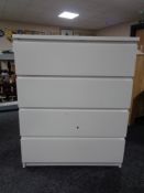 A contemporary white four drawer chest