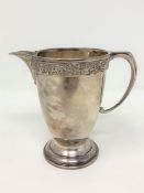 A Lindisfarne silver cream jug, Reid & Sons,