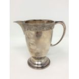 A Lindisfarne silver cream jug, Reid & Sons,