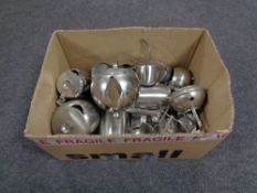 A box of stainless steel teapots, coffee pot,