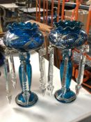 A pair of blue glass lustres with drops CONDITION REPORT: Numerous small chips to