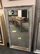A Two-tone silvered framed mirror 4' x 2'