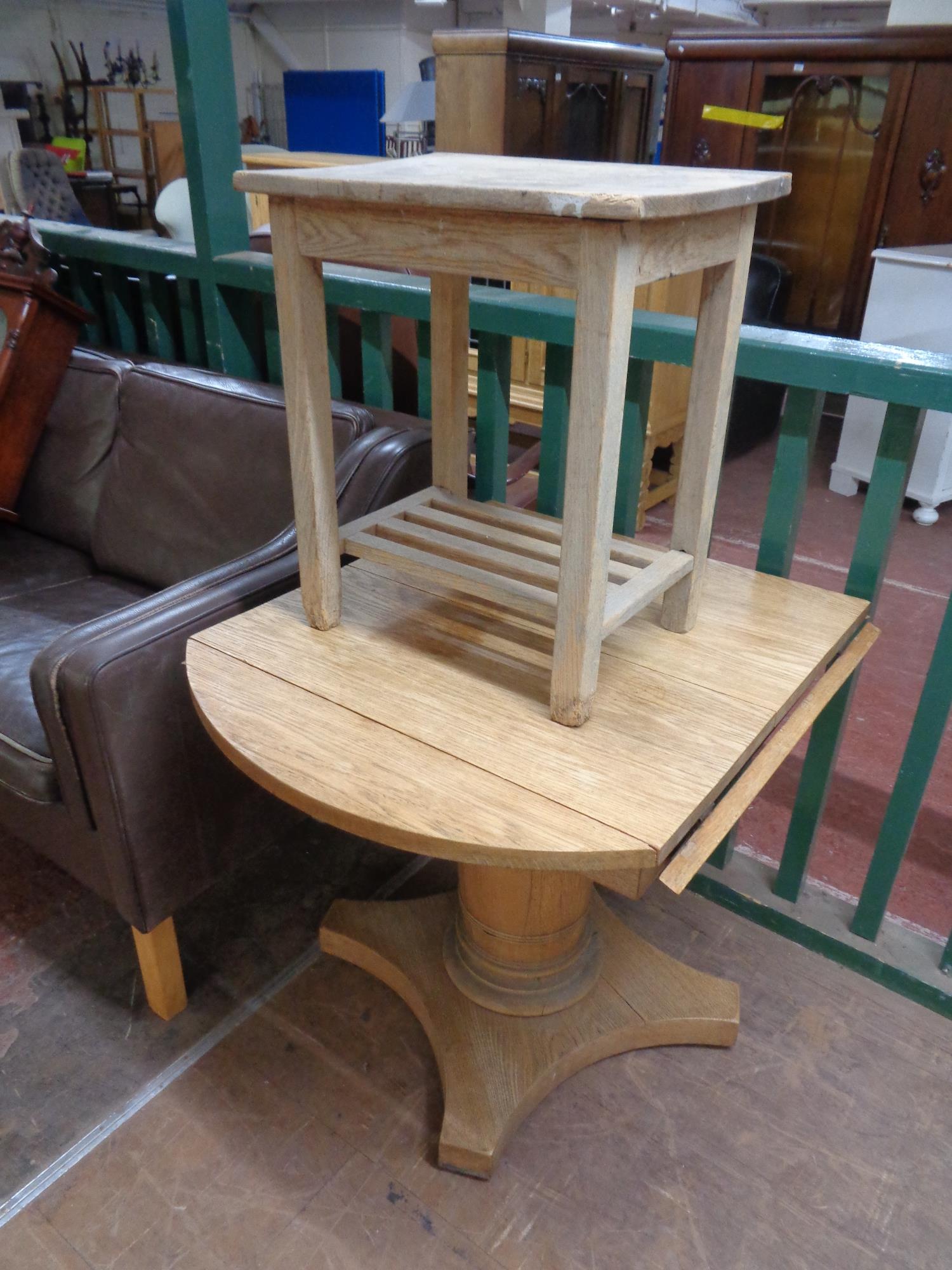 A pine side table with undershelf together with an antique continental oak pedestal flap sided