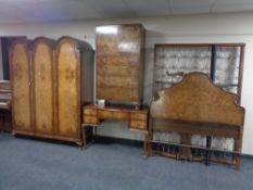 A four piece Palatial Furniture walnut bedroom suite comprising of triple door dome topped wardrobe,