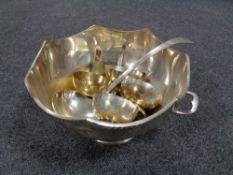 A silver plated punch bowl and ladle plus four cups