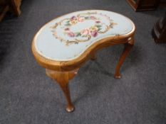 A kidney shaped tapestry upholstered walnut dressing table stool