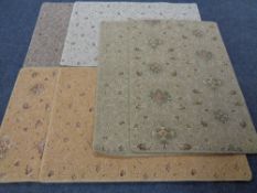 Six Axminster woolen rugs,