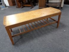 A 20th century teak extending coffee table with under shelf