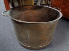 A 19th century copper twin handled pot, internal width 66cm,