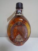 A bottle of Dimple The Old Original 15 years deluxe Scotch Whisky, 70 cl,