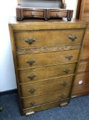 A 1930's oak five drawer chest