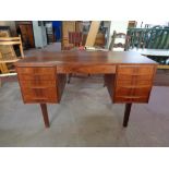 A mid 20th century teak twin pedestal desk, 121cm wide by 60cm deep by 72cm high.