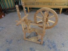 A 20th century blond oak spinning wheel
