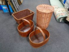 A wicker lidded basket and a further wicker log basket and two garden hand baskets