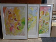 Three brass framed watercolours depicting flowers,