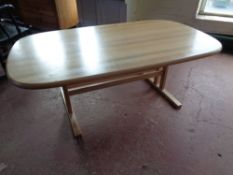 An oval beech refectory coffee table
