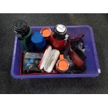 A crate of assorted flasks, Sheaffer & Parker pens, wallets,