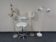 A metal and white plastic hydraulic bar chair and three continental lamps