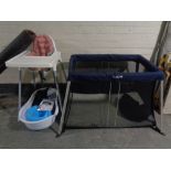 An Ikea high chair together with a Cugglo folding travel cot in carry bag,