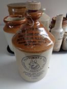 A tray of antique stoneware to include bottles, flagon, storage jars,