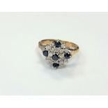 An 18ct gold diamond and sapphire ring, size O CONDITION REPORT: 5.