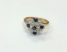 An 18ct gold diamond and sapphire ring, size O CONDITION REPORT: 5.