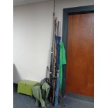 A bundle of sea fishing rods, two rod stands, a fishing box,