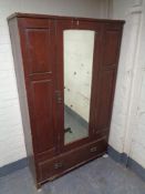An antique stained pine mirror door wardrobe (a/f)