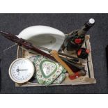 A basket of cast iron trivets, Booths Perfection bed pan, vintage Weigh Master scales,
