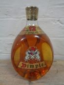 A bottle of Dimple 12 year old deluxe Scotch whisky,