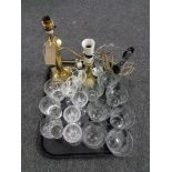 A tray of brass candlestick table lamp and one further, brass lamp,