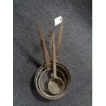 Five antique copper cast iron handled pans