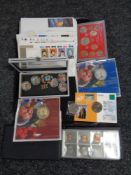 A tray of first day covers, commemorative coins,