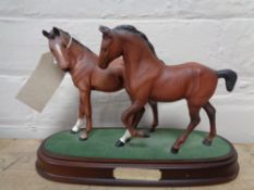 A Royal Doulton horse group Spirit of Love on wooden plinth