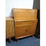 A mid 20th century teak writing bureau