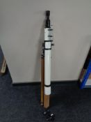 A Unitron D60MM F 900MM telescope with lenses on wooden tripod stand