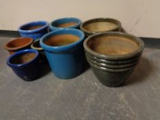 Seven assorted glazed pottery garden plant pots