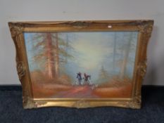 A gilt framed oil on canvas, huntsman on horse with hounds,