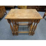 A nest of three oak tables