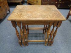 A nest of three oak tables