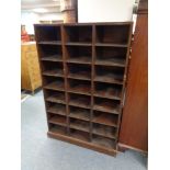 A set of early 20th century pigeon hole shelves fitted twenty four compartments, height 148 cm,