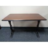 A 20th century rectangular bar table on cast iron legs